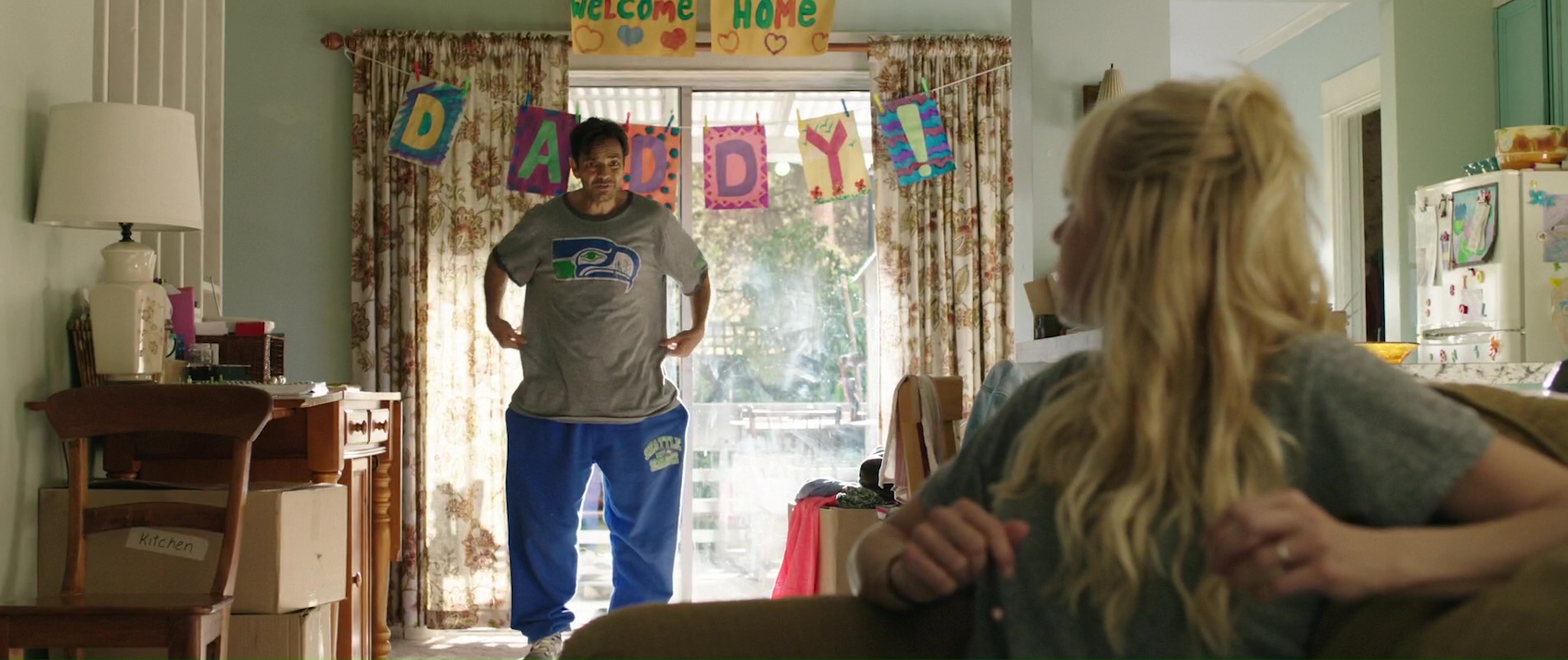 ...Seattle Seahawks T-Shirt and Blue Pants Worn by Eugenio Derbez in Overbo...