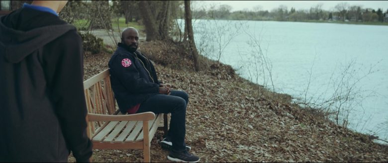 Mike Colter sitting on a bench