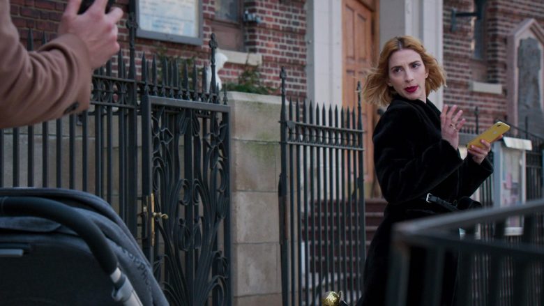 Molly Bernard standing in front of a building