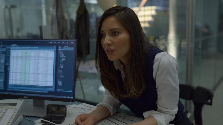 Olivia Munn sitting at a desk in front of a desktop computer