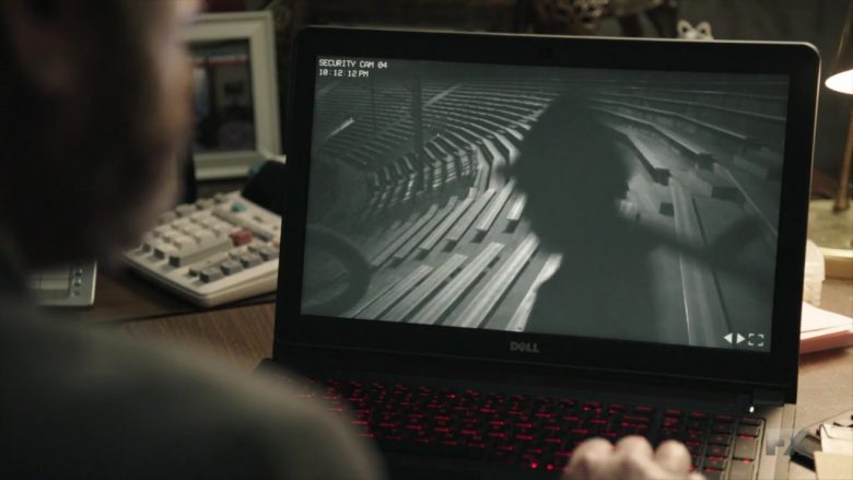 A flat screen tv sitting on top of a laptop computer