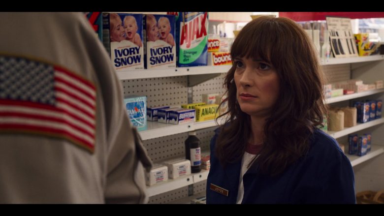 Winona Ryder standing in front of a store