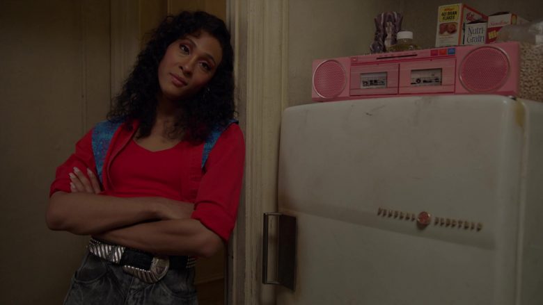 Mj Rodriguez standing in front of a refrigerator