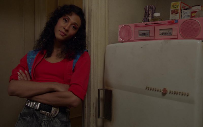 Mj Rodriguez standing in front of a refrigerator