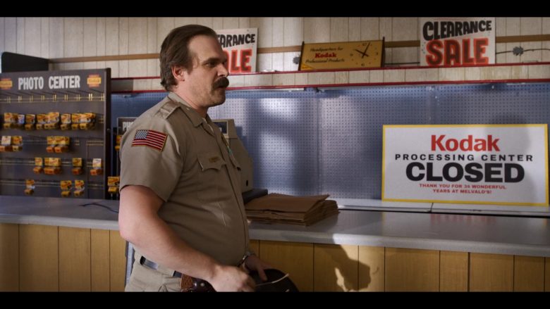 David Harbour standing in front of a counter