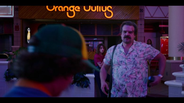David Harbour standing in front of a building