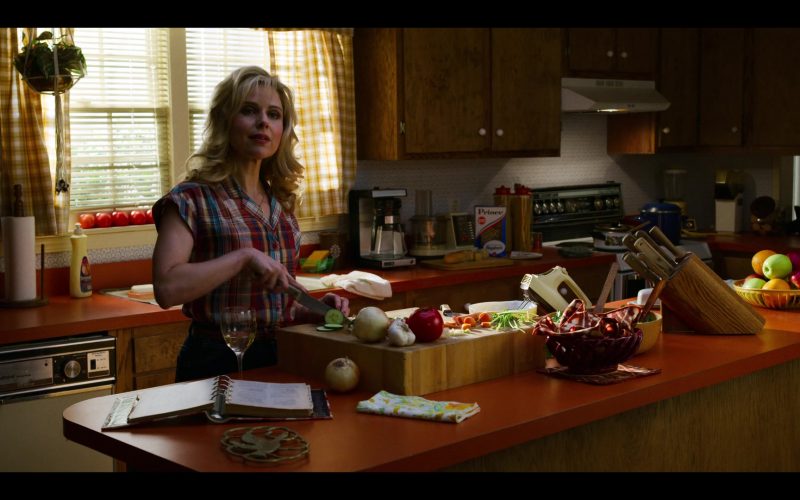 Cara Buono standing in a kitchen preparing food