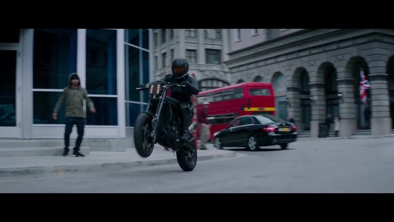A man riding a motorcycle on a city street