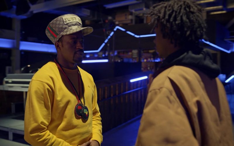 Champion Yellow Sweatshirt and Gucci Hat Worn by Johnell Xavier Young as Gary – Allah Justice in Wu-Tang An American Saga (1)