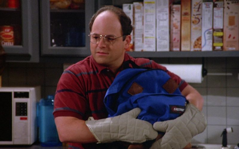 Eastpak Blue Backpack Held by Jason Alexander as George Costanza in Seinfeld Season 5 Episode 2 (2)