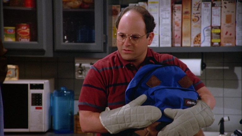 Eastpak Blue Backpack Held by Jason Alexander as George Costanza in Seinfeld Season 5 Episode 2 (3)