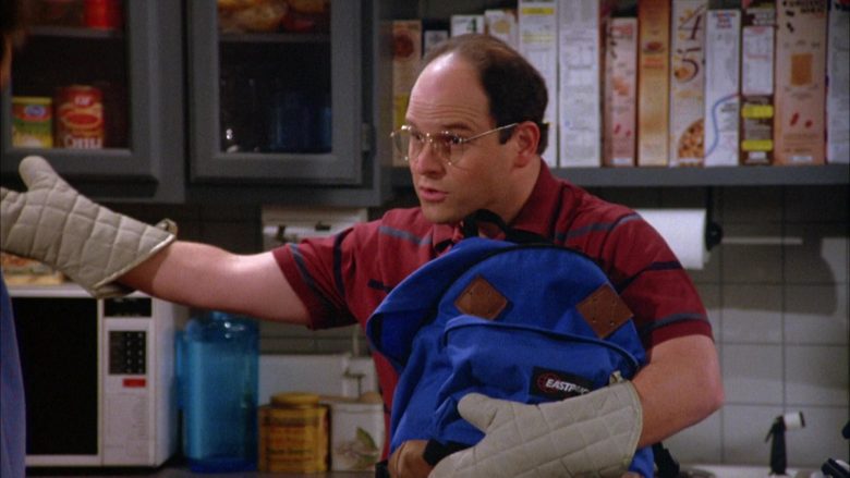 Eastpak Blue Backpack Held by Jason Alexander as George Costanza in Seinfeld Season 5 Episode 2 (4)