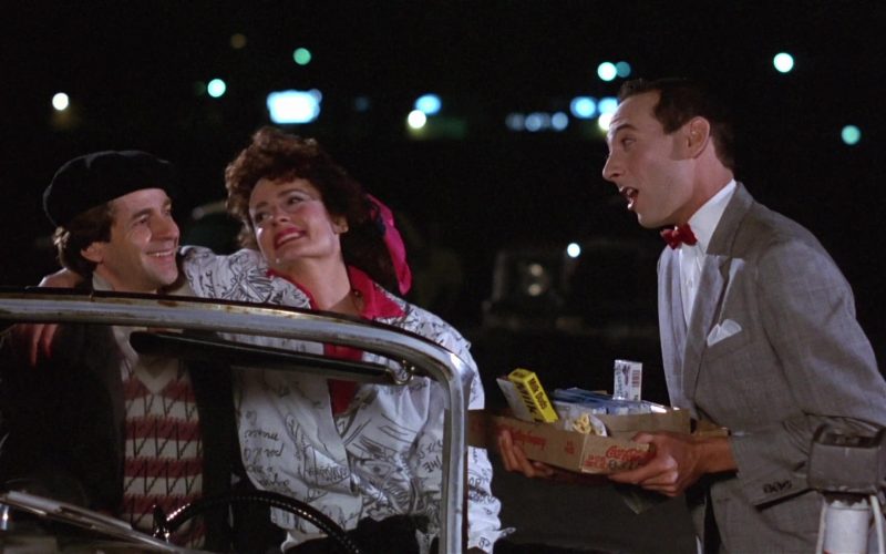 Milk Duds Candies by The Hershey Company and Coca-Cola Box Held by Paul Reubens in Pee-wee's Big Adventure (1985)