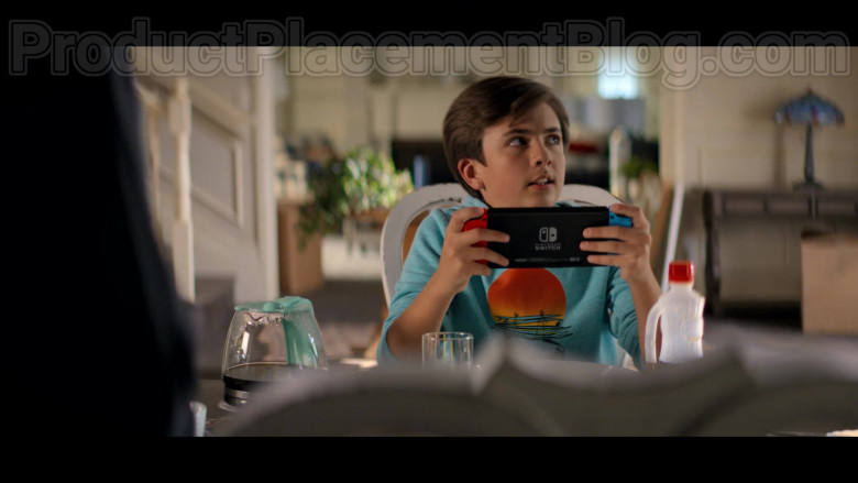 Young Actor Holding Nintendo Switch Video Game Console in Stargirl S01E02 S.T.R.I.P.E. TV Series (2)