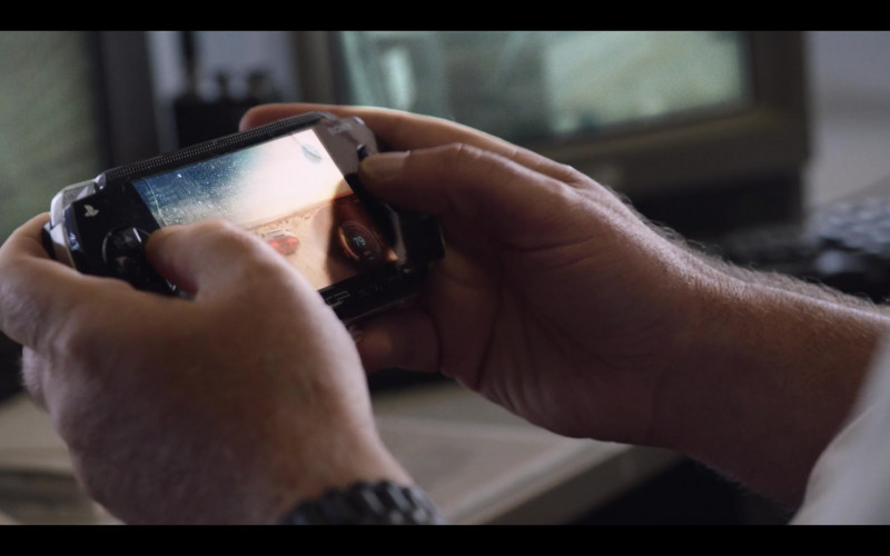 Actor Using PlayStation Portable (PSP) Gaming Console by Sony in Stateless S01E04