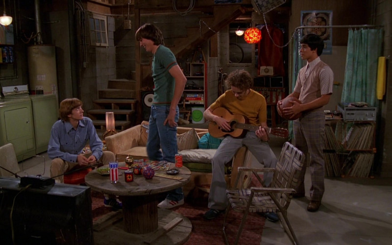 Adidas Shoes, Blue Jeans and Green T-Shirt Outfit of Ashton Kutcher as Michael Kelso in That '70s Show S01E02