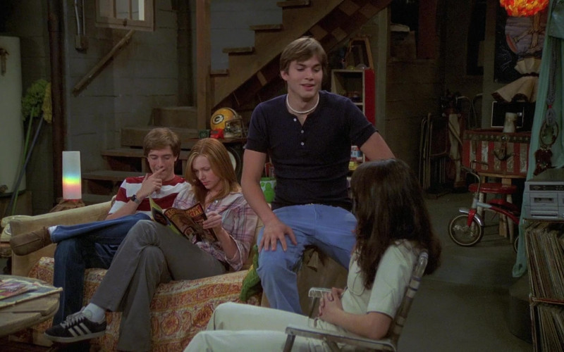 Adidas Shoes, Plaid Shirt and Gray Pants Casual Outfit of Laura Prepon as Donna in That '70s Show