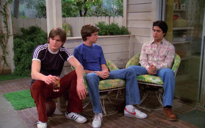 Adidas White Sneakers, Black T-Shirt and Stylish Pants Worn by Ashton Kutcher as Michael in That '70s Show