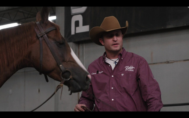 Classic Equine and Bob’s Custom Saddles Logo Shirt Outfit in Yellowstone S03E08
