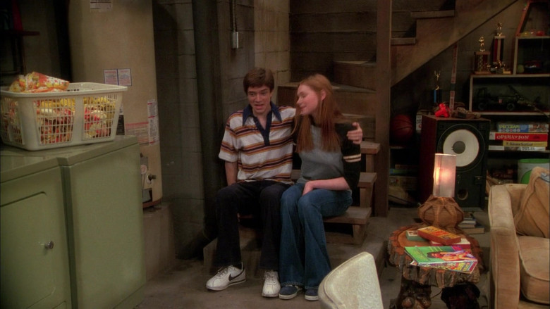 Nike Sneakers, Velvet Pants and Striped Short Sleeved Shirt Outfit of Topher Grace as Eric Forman in That ’70s Show