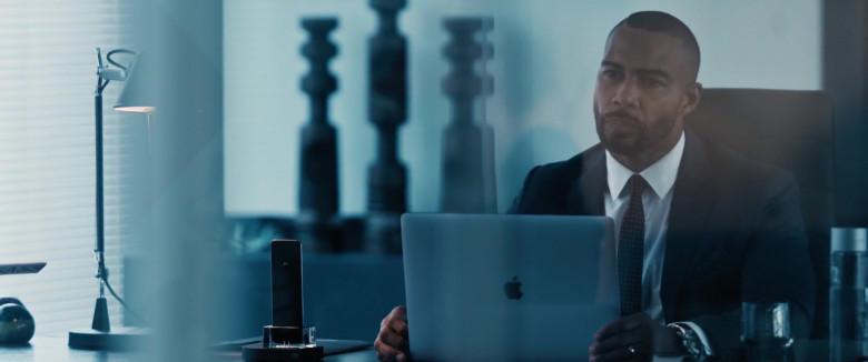 Apple MacBook Laptop and Motorola Phone of Omari Hardwick as Marquis T. Woods in Spell (2020)