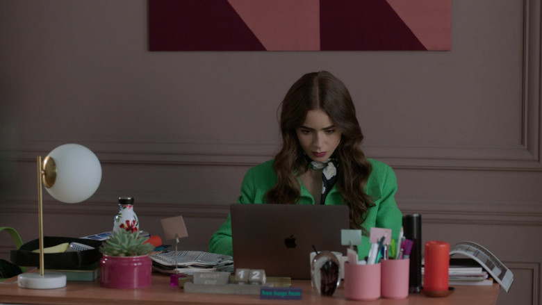 Apple MacBook Pro Laptop of Lily Collins as Emily Cooper in Emily in Paris S01E05