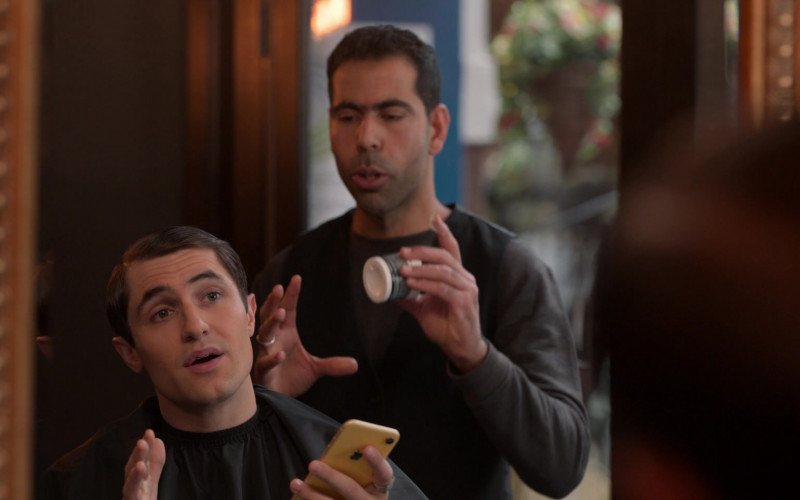 Apple iPhone Yellow Smartphone Held by Actor in Ted Lasso S01E10