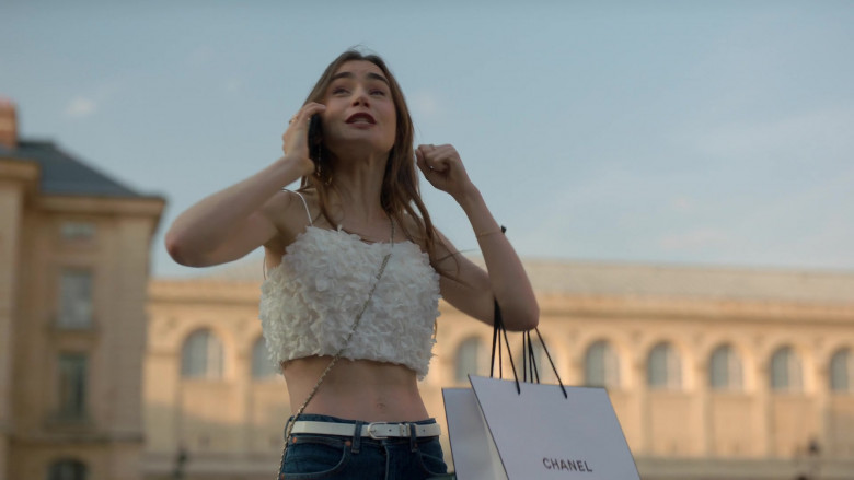 Chanel Logo Paper Bag Held by Lily Collins in Emily in Paris S01E02