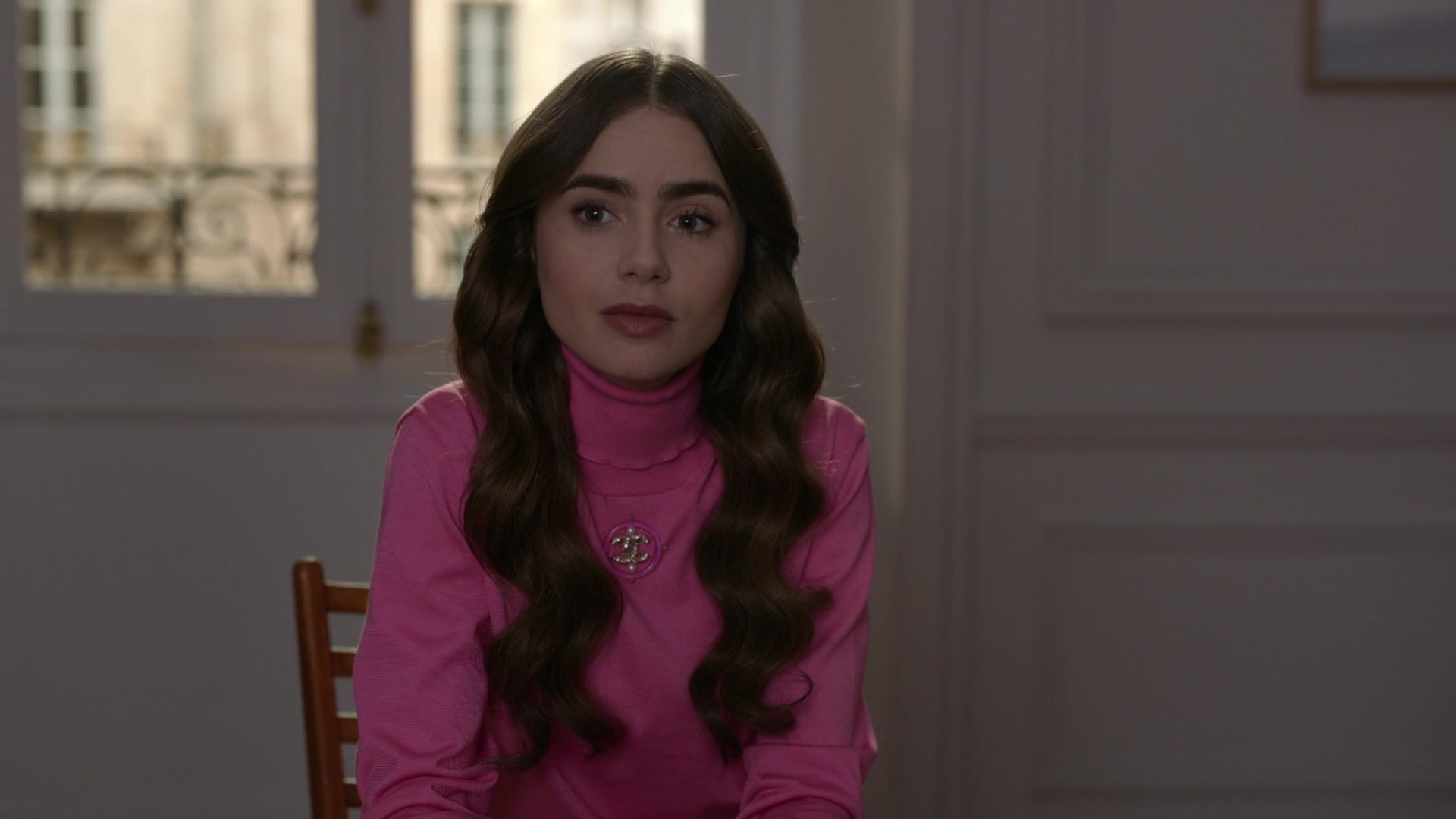 Chanel Pink Turtleneck of Lily Collins in Emily in Paris S01E09 &quot;An American Auction in Paris ...