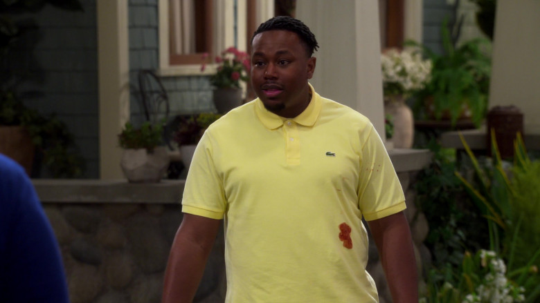 Lacoste Yellow Polo Shirt of Marcel Spears as Marty in The Neighborhood S03E01 Welcome to the Movement (2020)