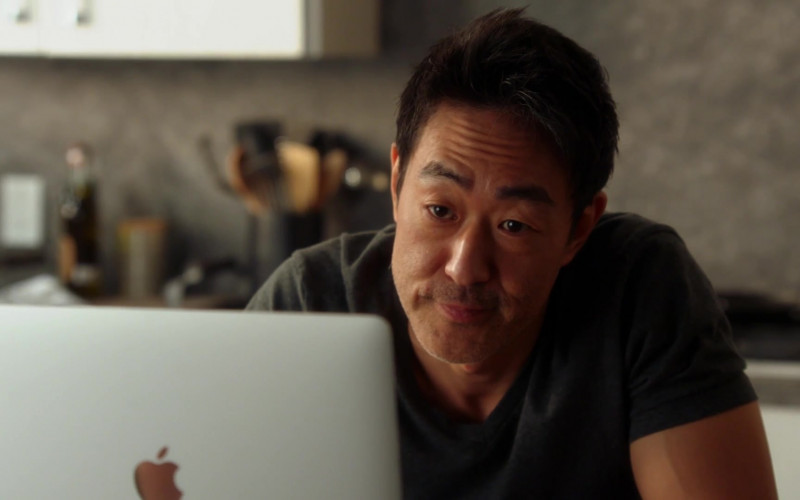 Apple MacBook Pro Laptop of Kenneth Choi as Howard ‘Howie' – ‘Chimney' Han in 9-1-1 S04E01