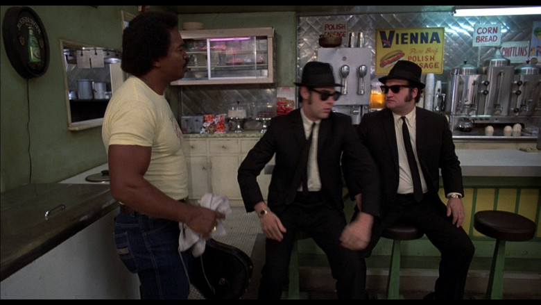 Augsburger beer round sign (one the left wall) and Vienna Sauce Sign in The Blues Brothers (1980)