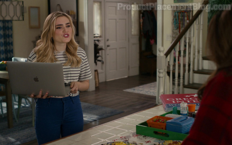 Apple MacBook Pro Laptop Held by Meg Donnelly as Taylor Otto in American Housewife S05E09 The Heist (2021)