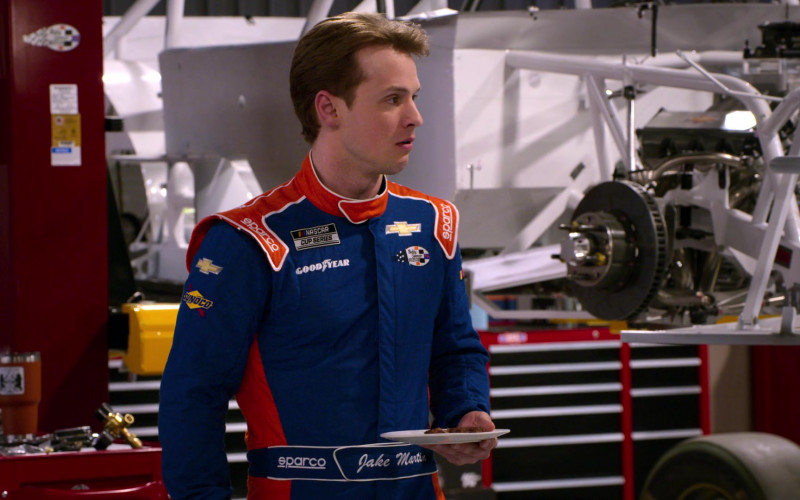 Chevrolet, Sunoco, Sparco and Goodyear Logos on the Racing Suit in The Crew S01E03