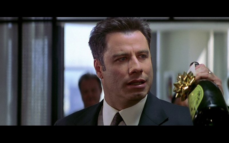 Dom Pérignon champagne bottle held by John Travolta as Sean Archer in FaceOff (1997)