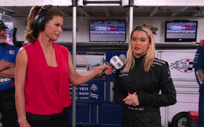 Impact Racing and Goodyear Logos on the Racing Suit of Paris Berelc as Jessie De La Cruz, Fox TV Channel, Yeti, Mobil 1, Gander, Pit Boss and Sunoco in The Crew S01E07