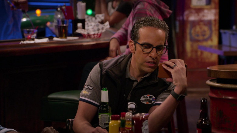 Nascar Chevrolet Logo Patches on the Grey Polo Shirt of Dan Ahdoot as Amir in The Crew S01E09