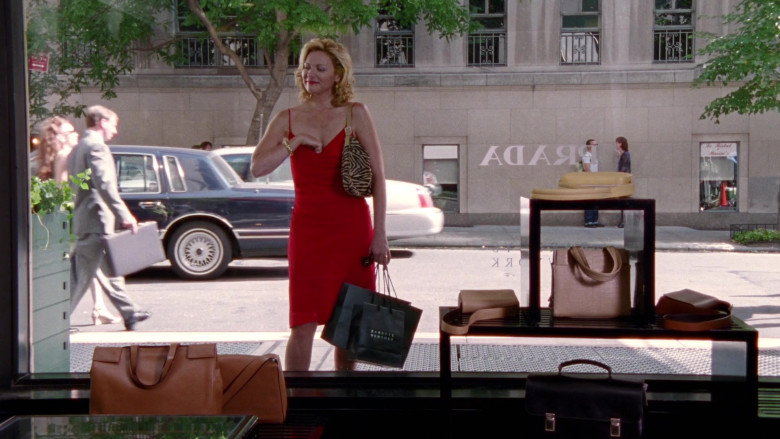 Barneys New York Store Bag Held by Kim Cattrall as Samantha Jones and Prada Store and Prada Handbags in Sex and the City S02E18 Ex and the City (1999)