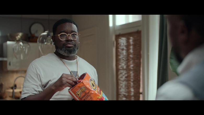 Cheetos cheese puff snack Enjoyed by Lil Rel Howery as Jordan in Fatherhood (2021)