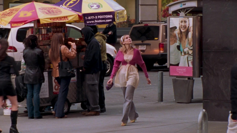Coach New York American luxury design house advertising in Sex and the City S06E01 To Market, to Market (2003)