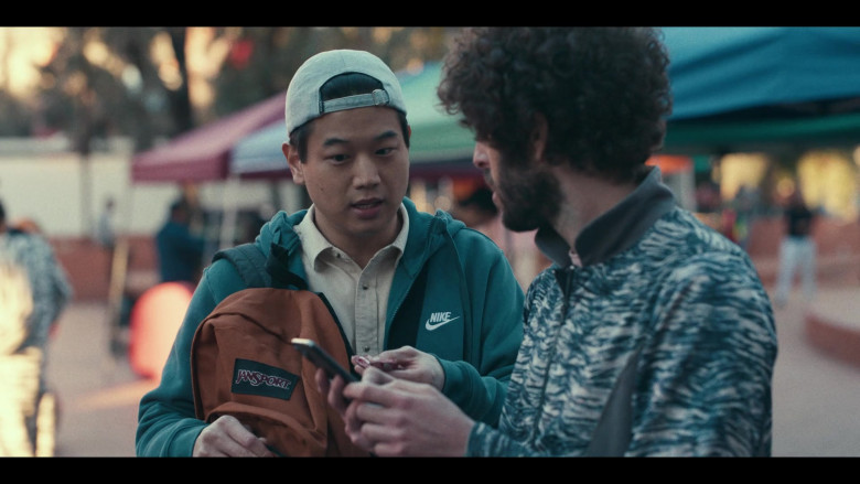 JanSport Brown Backpack Held by Actor Ki Hong Lee in Dave S02E01 International Gander (2021)