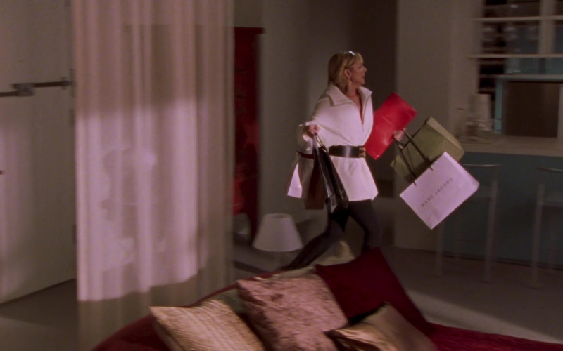 Marc Jacobs Store Paper Bag Held by Kim Cattrall as Samantha Jones in Sex and the City S05E01 Anchors Away (2002)