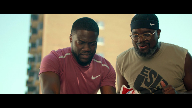 Nike Pink T-Shirt of Kevin Hart as Matthew Logelin and Nike Headband of Lil Rel Howery as Jordan in Fatherhood (2021)