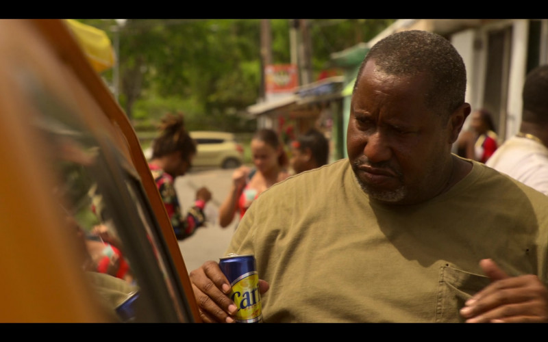 Carib Premium Lager Held by E. Roger Mitchell as Heyward in Outer Banks S02E01 The Gold (2021)