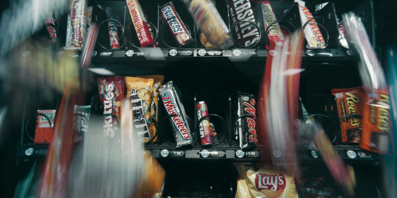 Mars, Whatchamacallit, Mentos, Snickers, Hershey’s, Zagnut, Payday, Tic Tac, Dentyne Ice, Skittles, M&M’s, 3 Musketeers, Life Savers, Reese’s, Lay’s in Schmigadoon! S01E01 Schmigadoon! (2021)