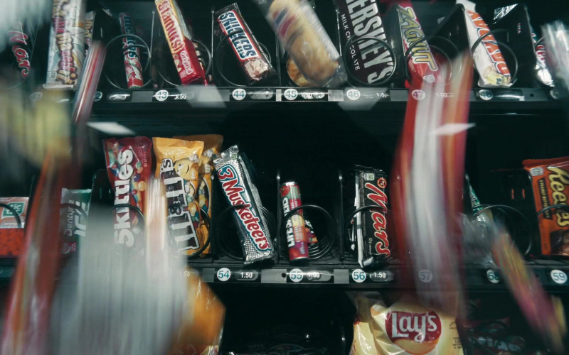 Mars, Whatchamacallit, Mentos, Snickers, Hershey’s, Zagnut, Payday, Tic Tac, Dentyne Ice, Skittles, M&M’s, 3 Musketeers, Life Savers, Reese’s, Lay’s in Schmigadoon! S01E01 Schmigadoon! (2021)