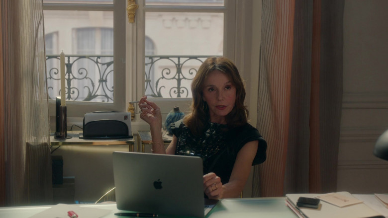 Apple MacBook Laptop PC of Philippine Leroy-Beaulieu as Sylvie Grateau in Emily in Paris S02E05 An Englishman in Paris (2021)