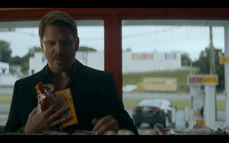 Kinder Bueno Chocolate Bars and Milk Duds Candy in Ray Donovan: The Movie (2022)