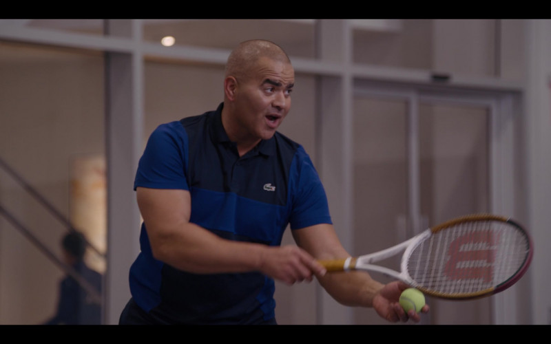 Lacoste Men’s Polo Shirt and Wilson Tennis Racquet in And Just Like That… S01E07 Sex and the Widow (2022)