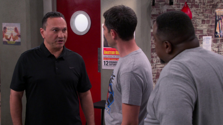 Nike Men’s Black Polo Shirt in The Neighborhood S04E11 Welcome to the Knockout (2022)